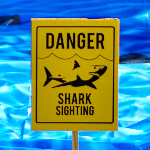 Warn {and welcome} your guests to the party with these fun shark sighting signs!